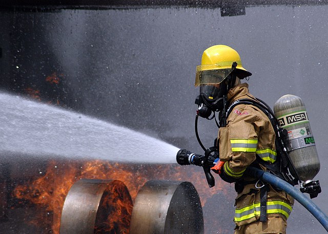 A Naval Air Facility Atsugi, Japan-based CNFJ Regional Firefighter douses out a live fire on a dummy aircraft during the baseís annual Off Station Mishap drill at Naval Support Facility Kamiseya, July 30. During the drill, emergency response and rescue teams were tasked with putting out a simulated fire, and rescuing two personnel from a plane crash scene.